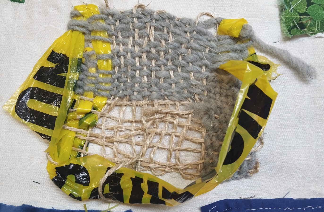 weaving with wool, sisal and caution tape