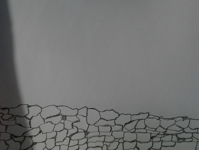 This image depicts a pencil drawing of a section of the dry stone wall pictured previously as a photograph. In this drawing a shadow is deliberately allowed to encroach upon the image from the left, reminding viewers that this is not only an image but an image of an image.