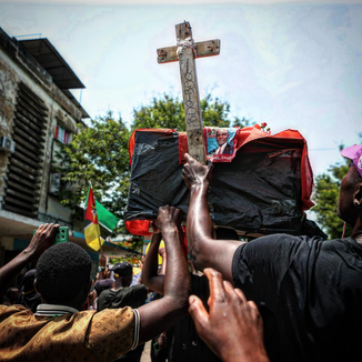 Protestors carrying Frelimo´s symbolic coffin in a demonstration in Maputo, Mozambique.