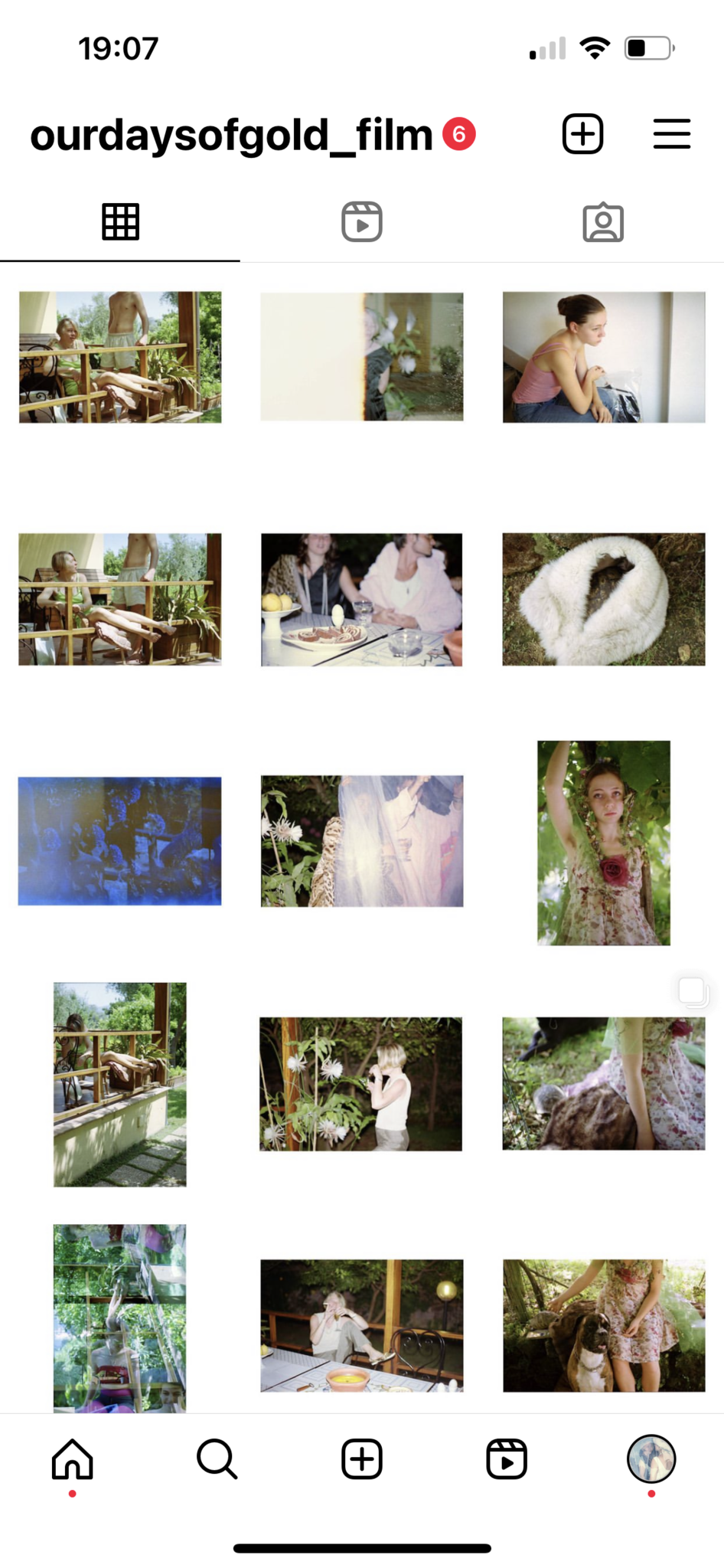 A screenshot of the Instagram profile @ourdaysofgold_film, showing a section of the photo grid. The images capture domestic and outdoor family scenes, portraits, and still-life compositions, many featuring soft natural light and vintage tones. Visible photos include people lounging on a terrace, intimate gatherings around a table, floral details, and playful or staged moments in a garden.