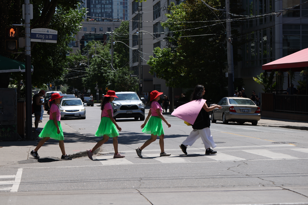 A walk with a playful question, 'To cake or not to cake?, invited pedestrians and patio patrons at the popular destination at King and Portland to reflect within a space largely defined by consumerism.

In response to Score 4 created by Mushtari Afroz