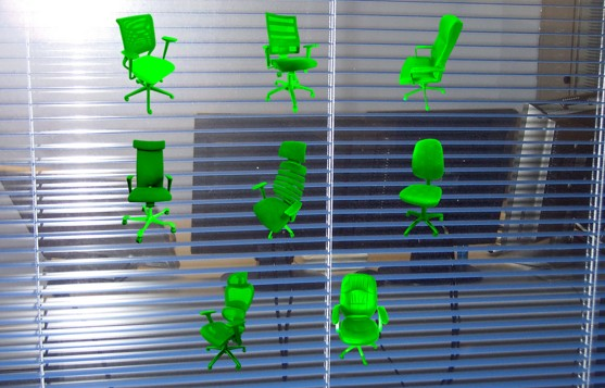 Screenshot of the exposition by Ana de Almeida showing a graphic of green office chairs montaged in front of a window to an office.