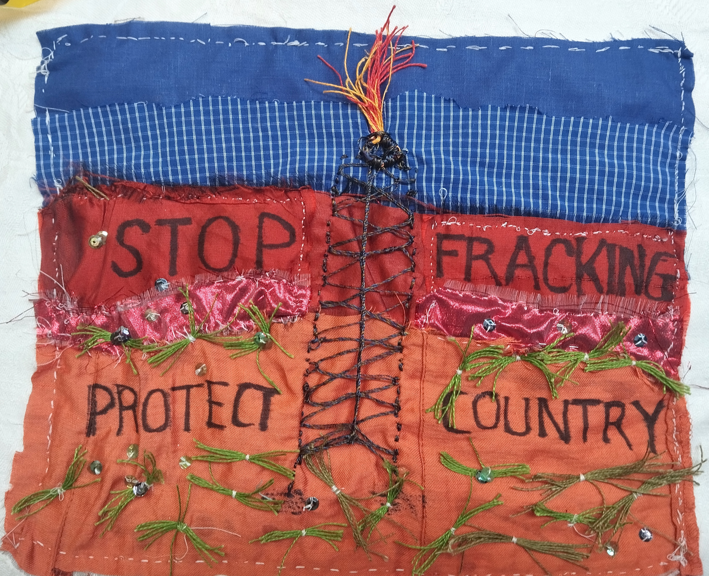 applique with red and blue and stop fracking