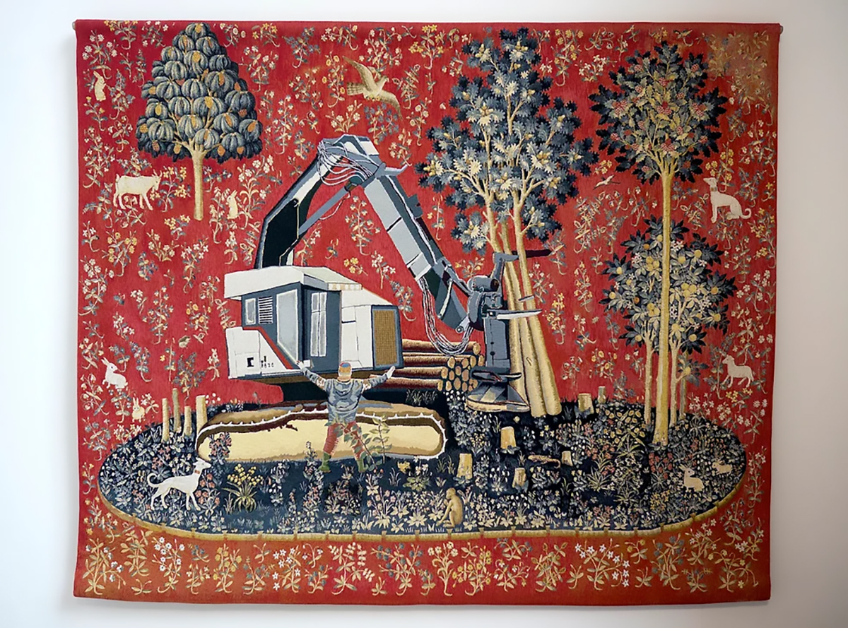 A rectangular wall hanging is covered with floral patterns. An excavaor is cutting down trees on an oval area. A person is standig in front of it trying to stop the machine. In the background there are various small animals such as monkeys, dogs, sheep, birds rabbits, and goats.