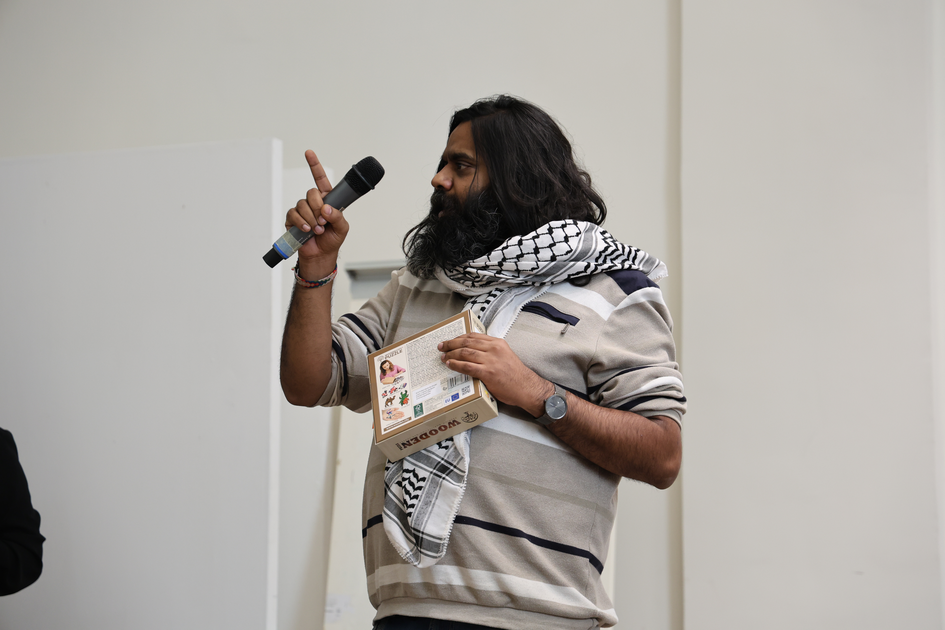 Photo of Ujjwal Utkarsh, one of the prize winners, speaking into a microphone.